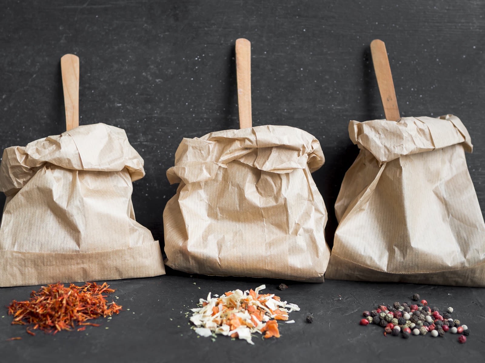 Wooden spoons inside paper bags