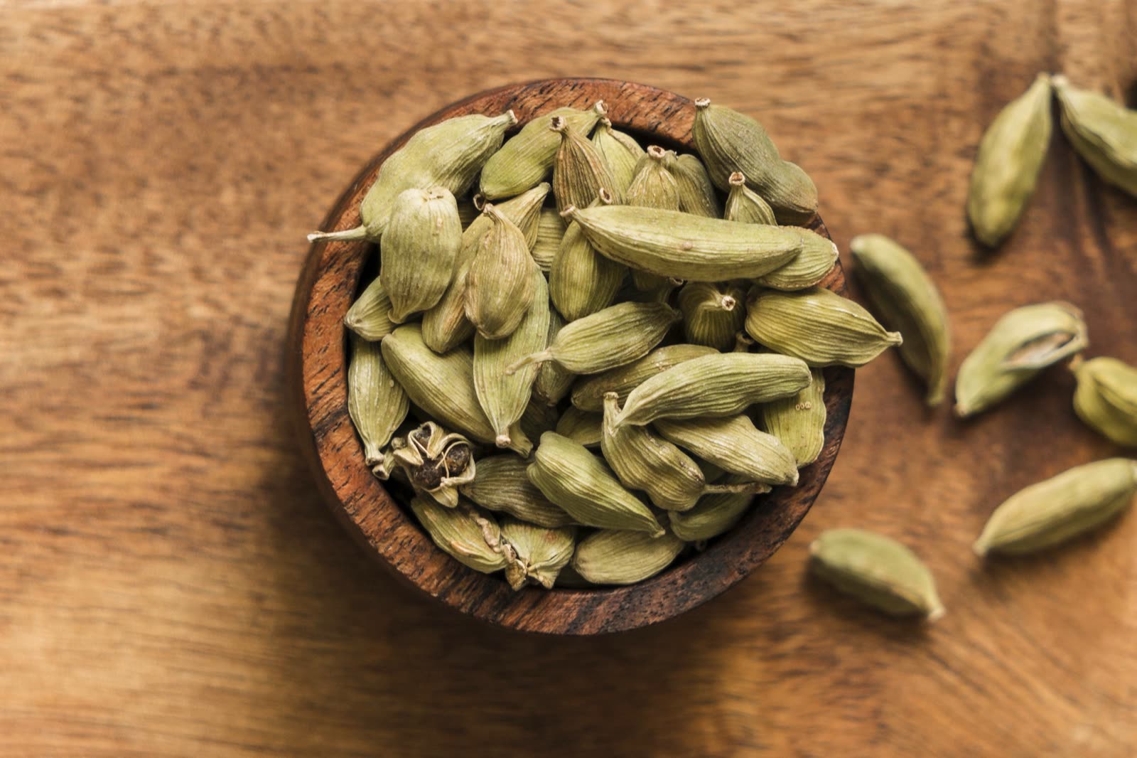 Top view bowl with seeds (green cardamom pods)