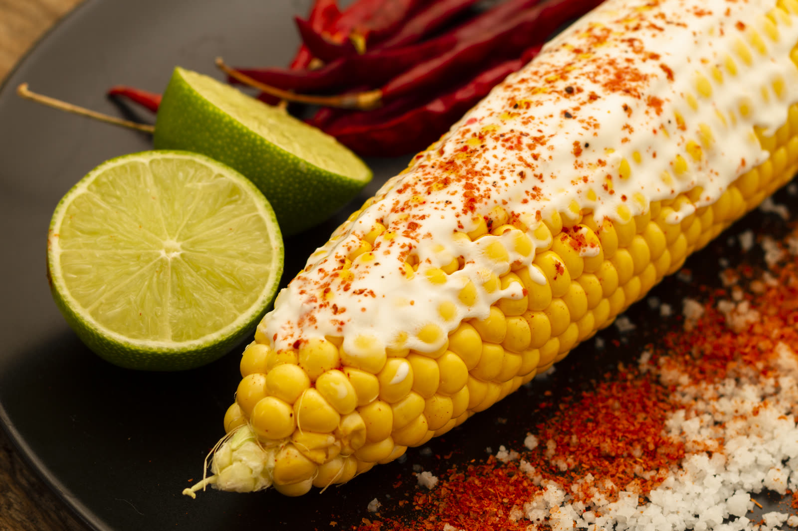 Close-up boiled corn with chili powder